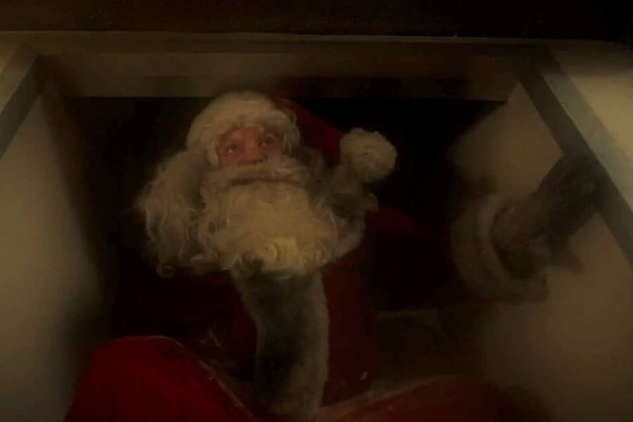 angry Santa drops down from the chimney