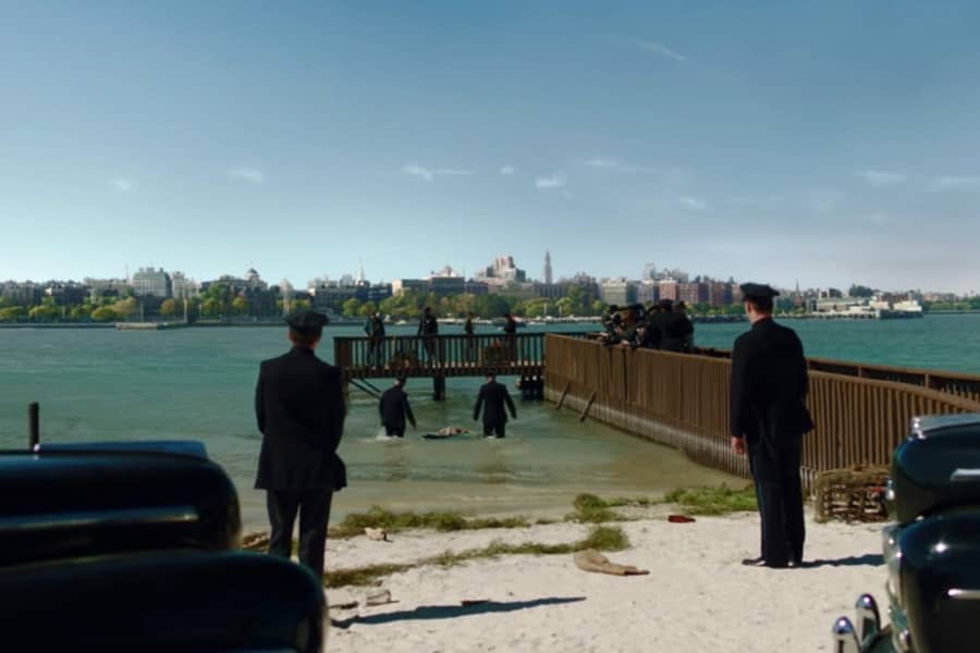 1930s cops investigate the water near a short pier