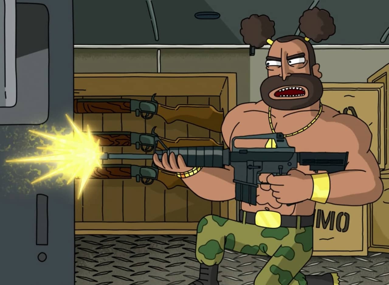 a Mr. T type tough guy shoots a machine gun