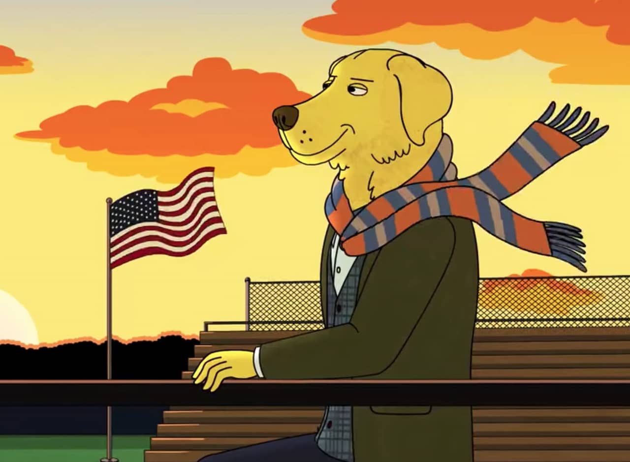 Mr. Peanutbutter (a golden retriever) wears a scarf and stands atop empty bleachers