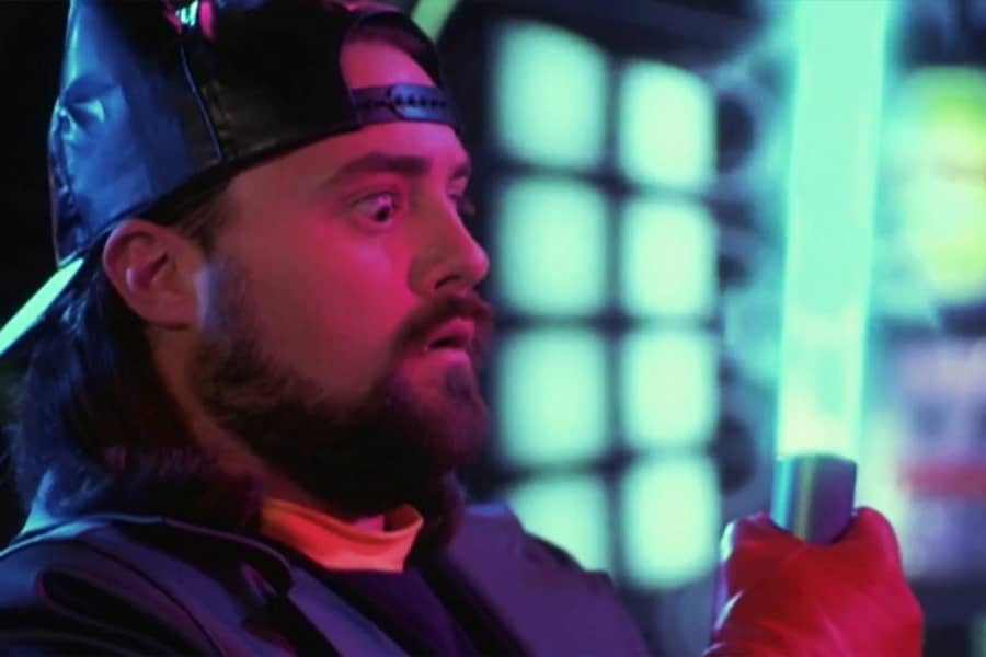 Silent Bob holding a light saber