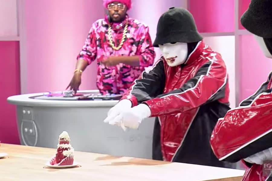 Dance crew Jabbawockeez choosing their favorite cupcake