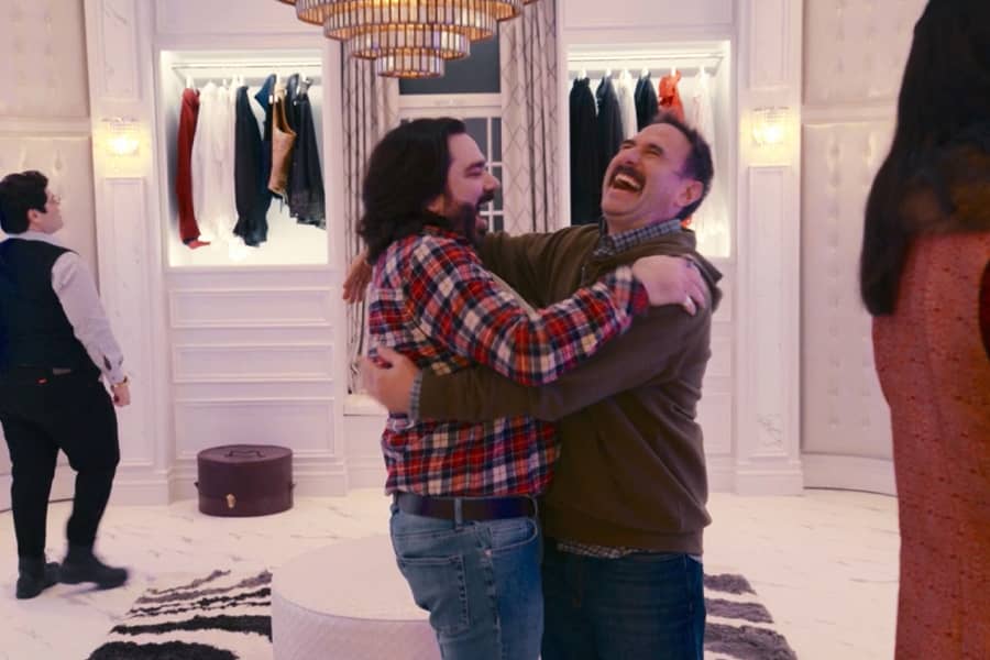 Bran hugs Laszlo in a fancy walk-in closet