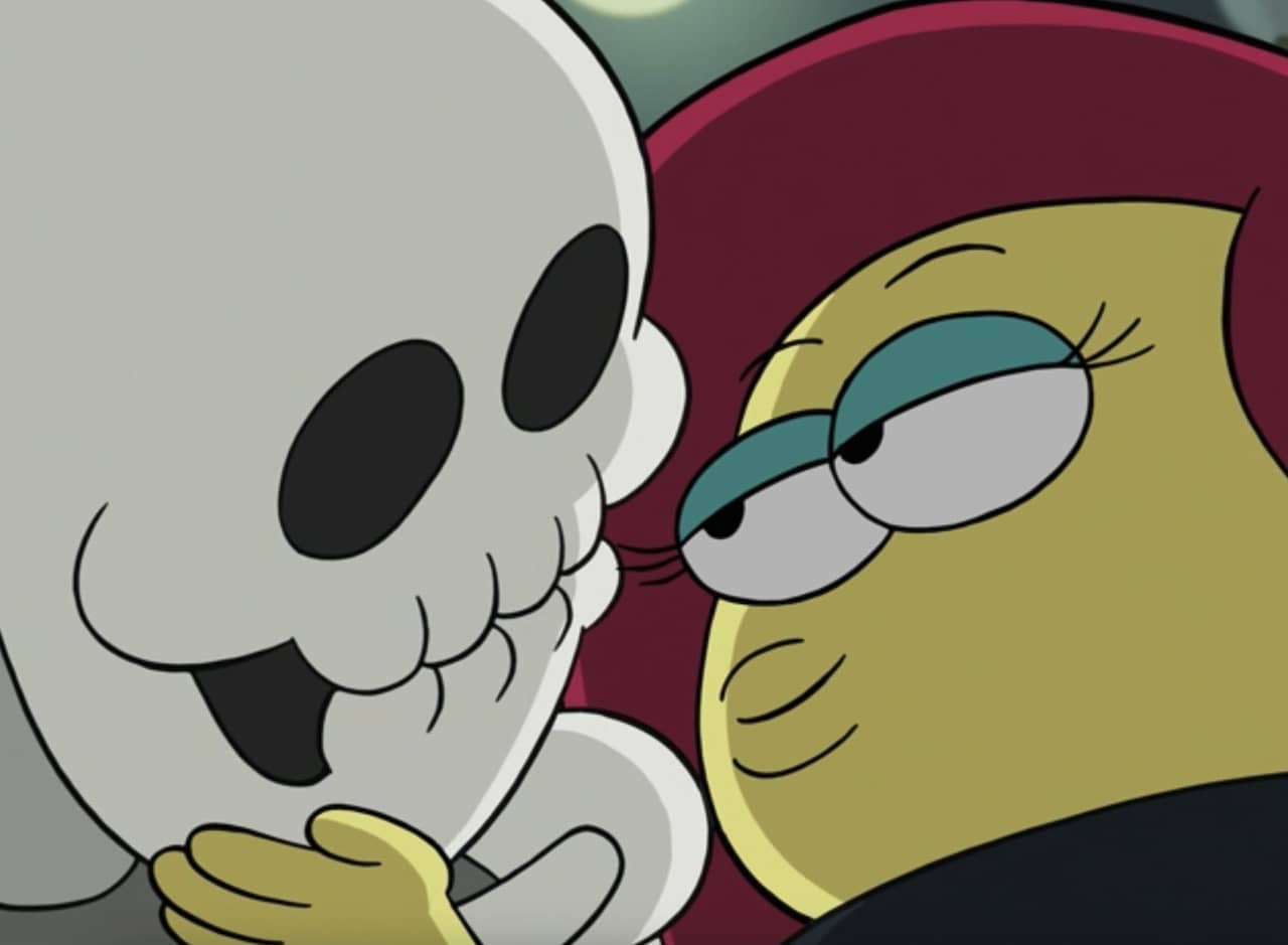 a woman leans in to smooch a skeleton