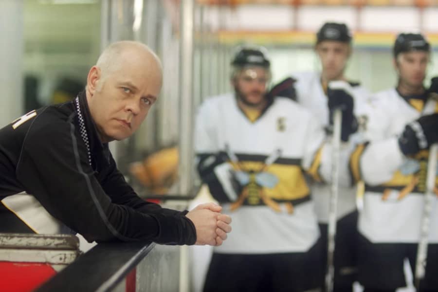 James Michael Tyler as an opposing team’s coach