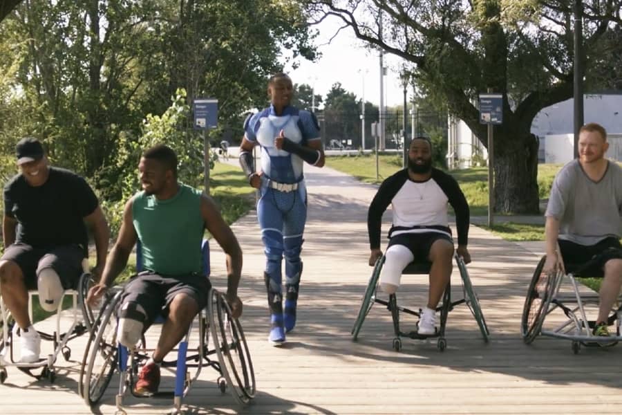 A-Train running next to amputees in wheelchairs