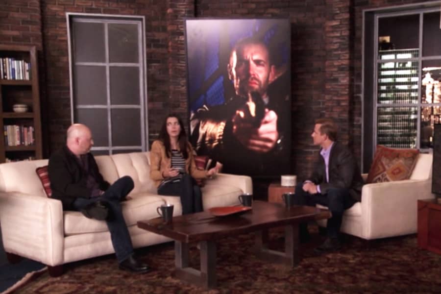 Tom Cotter, Joseph Weisberg, and Carmen Lynch in a living room-like set