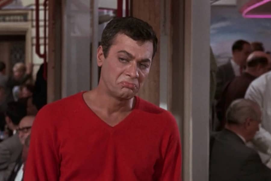 Tony Curtis shrugs