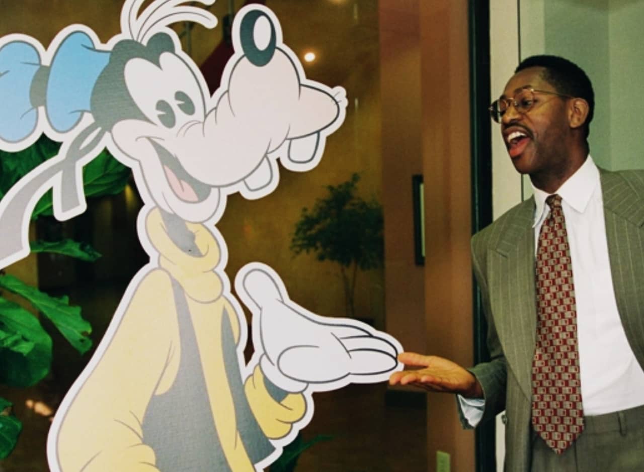 Thomas Washington next to a Goofy cardboard cutout