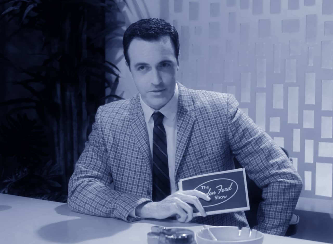 host Gordon Ford as his talk show desk