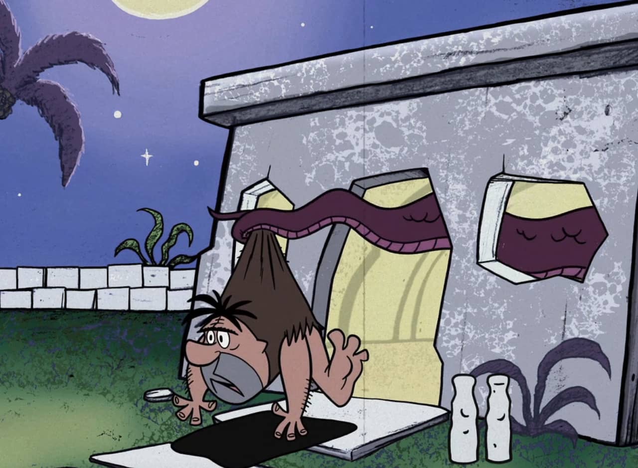 Frank, a caveman, is being kicked out of his stone house by a long dinosaur tail