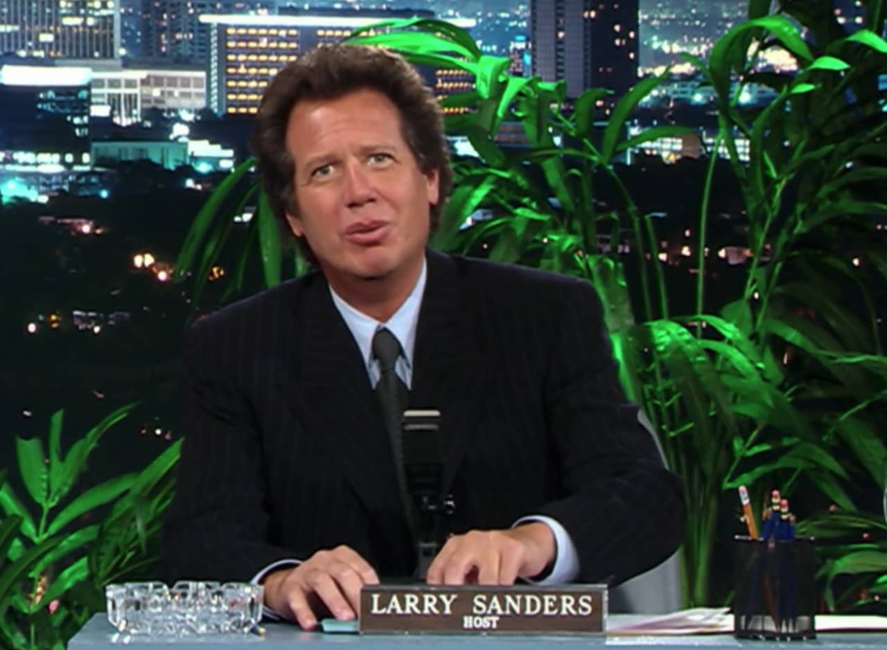 Larry Sanders at his talk show desk