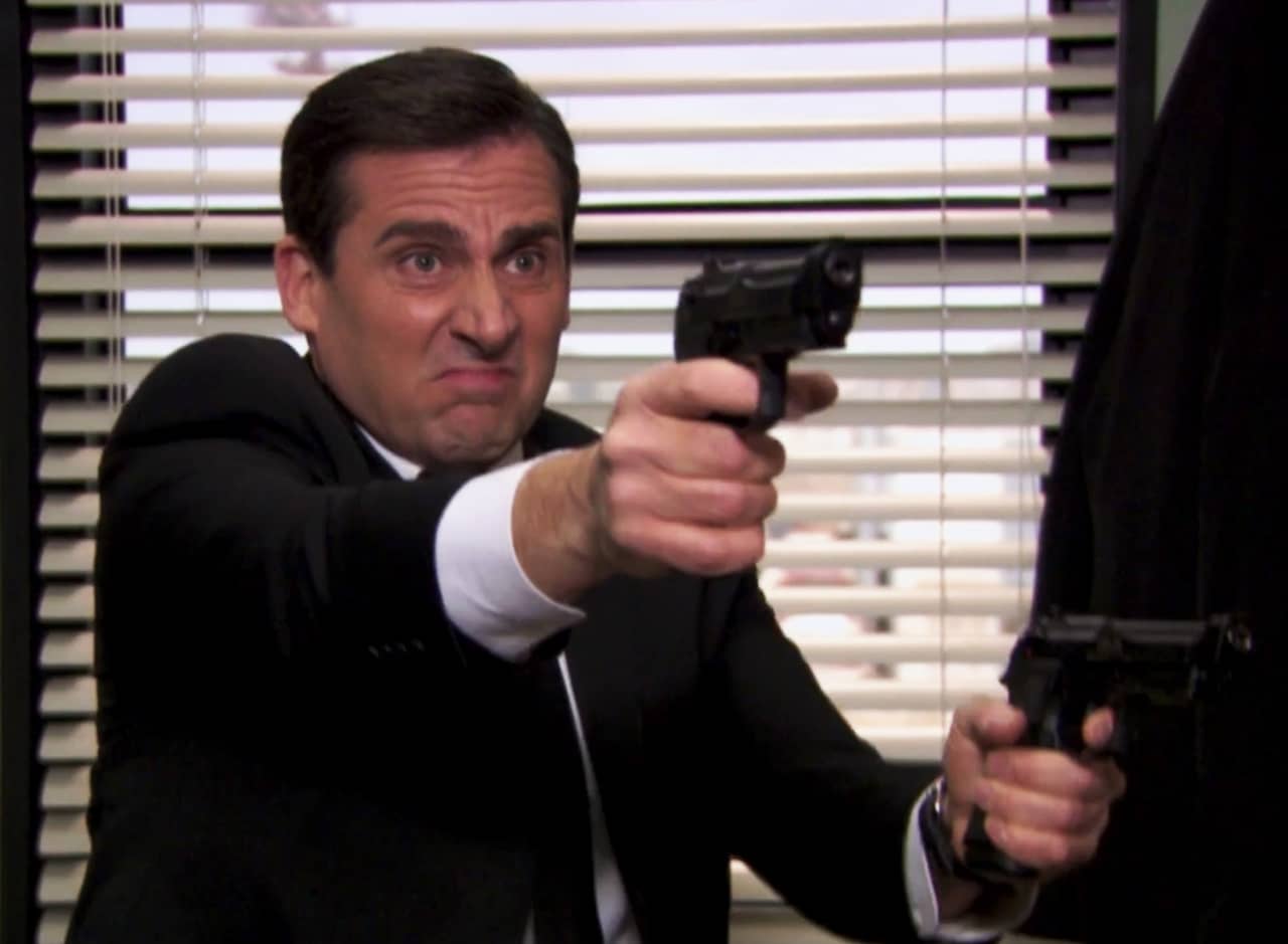 Michael Scott is Michael Scarn, shooting two guns