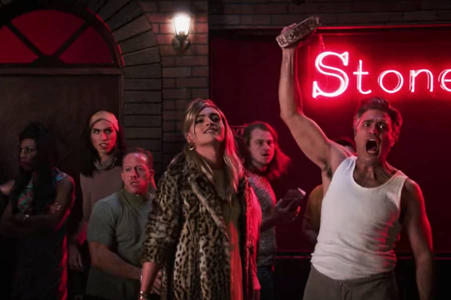 Tiago raises a brick at the Stonewall rebellion