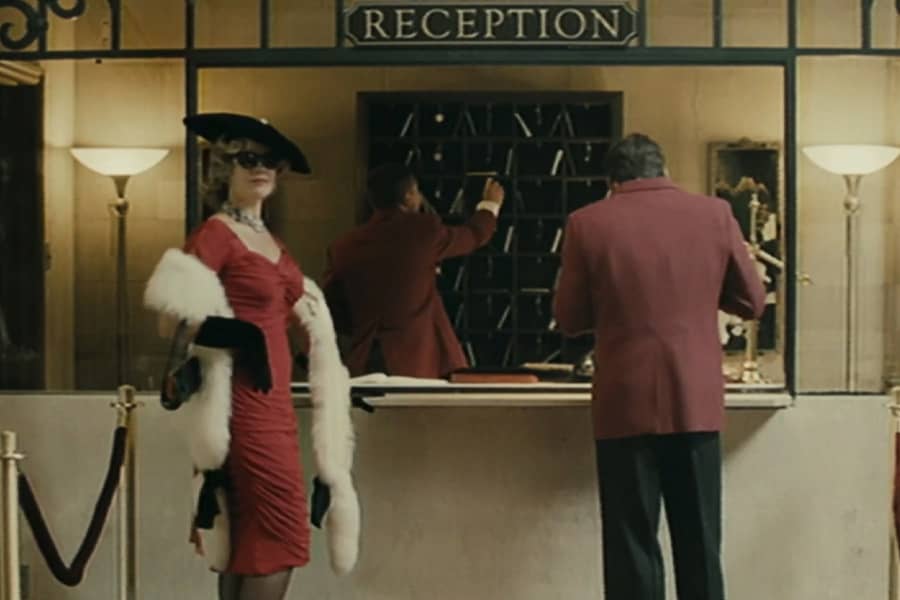 Lipton at the reception desk at a vintage hotel